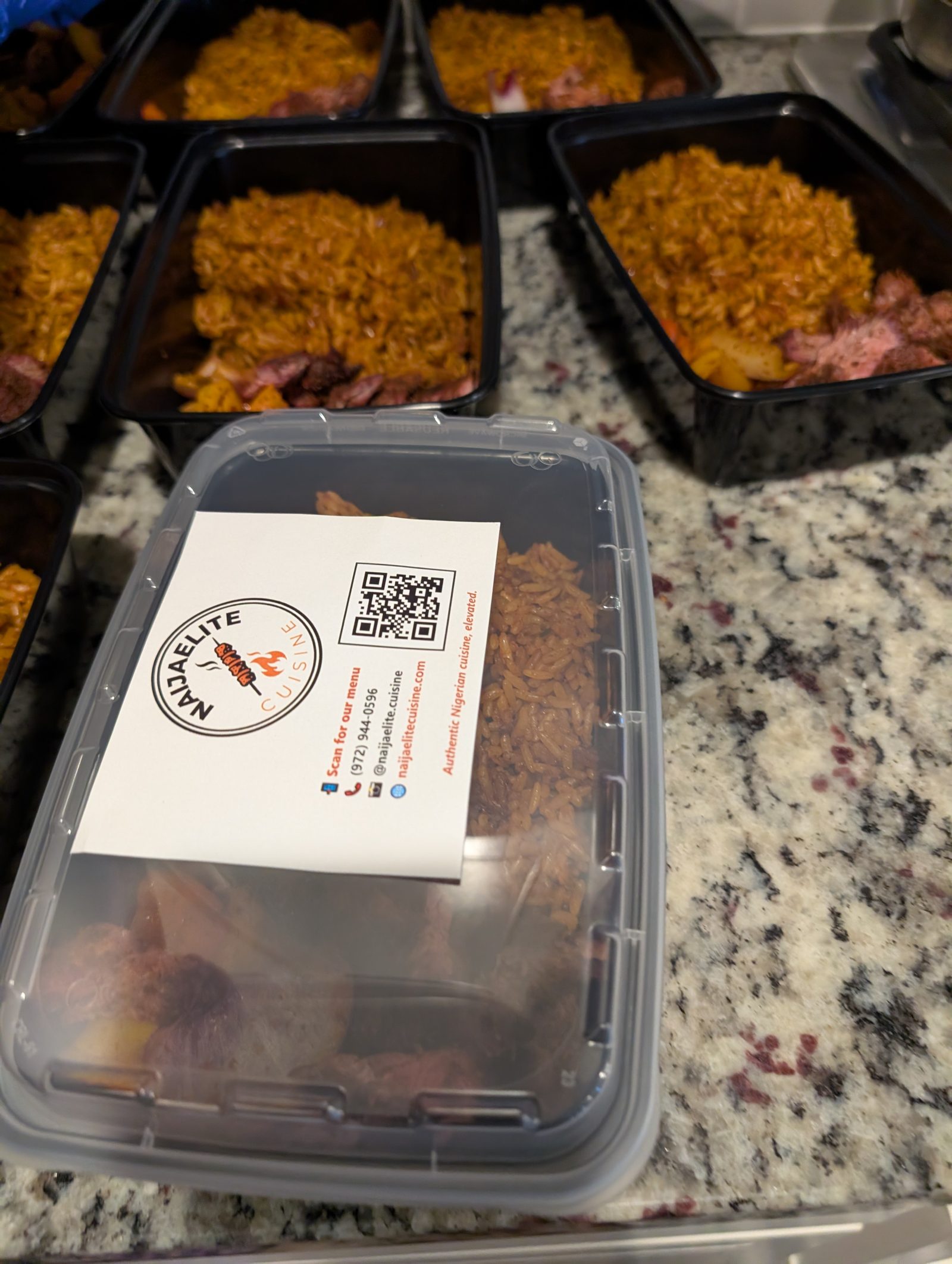 NaijaElite Cuisine branded catering container with jollof and suya